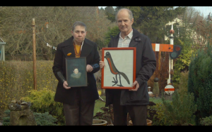 From the film ‘Audience Appreciation’ (Dan Fox, 2014). Glenys and John Fox, holding childhood paintings by the author, Wheatley, 2014 