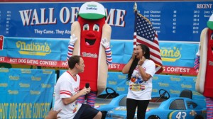 Joey Chestnut drops to his knees before Neslie Ricasa this July