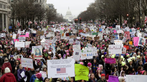 Demonstrators protest during the Women's March along Pennsylvania Avenue January 21, 2017 in Washington, DC. Hundreds of thousands of protesters spearheaded by women's rights groups demonstrated across the US to send a defiant message to US President Donald Trump. / AFP / Joshua LOTT (Photo credit should read JOSHUA LOTT/AFP/Getty Images)